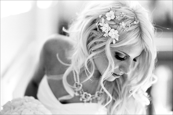 Bride wearing summer-inspired flower hair pieces  - Wedding Photo by Bradley Hanson